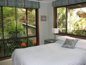 Main bedroom with a very comfy King bed and leafy outlook.