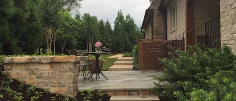 Side Terrace with Bistro Table and path that leads to apartment