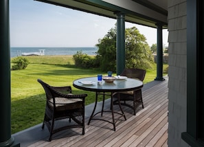 Large veranda complete with outdoor furniture and ocean views
