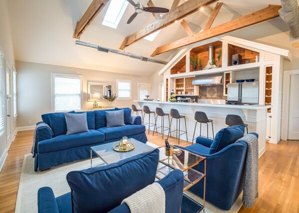 Open layout with pull out sofa and bar seating for 6