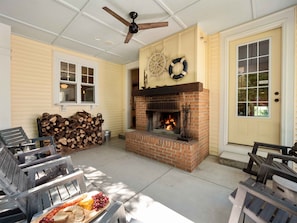 Covered outdoor porch with wood burning fireplace - great for happy hour, s'mores