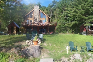 Our Log Home has a large Deck & Patio and 75' of Lake Front