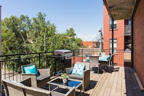 Sunny deck with table, BBQ and outdoor furniture