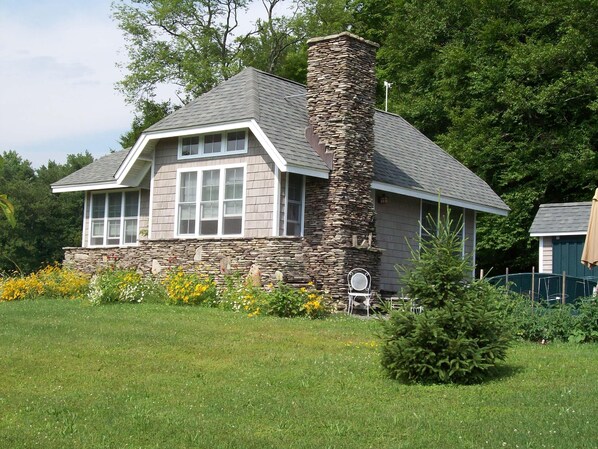 English cottage design built with stones gathered on the property