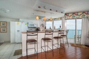 Fully Stocked Eat in Kitchen with Bar/Million Dollar Views. Extra Wide 
Balcony.