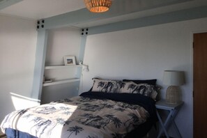 Main bedroom with view of the sea from bed