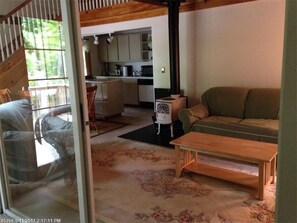 Looking into living room  and kitchen from sun room