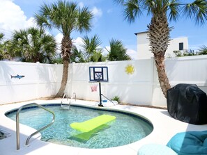 Backyard pool/bar area with privacy fences!