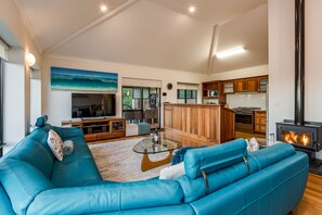 Relax in the spacious main lounge with ocean views, a potbelly fire, and plush seating.