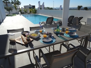 Enjoy breakfast at the pool