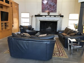 living room with oversized fireplace