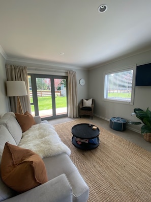 Living area, door open onto the deck 