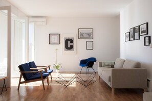Living room with modernist furniture including Murković chair and Alanda table