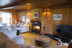Cozy living room with fireplace and 40" HD TV