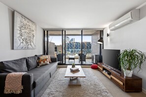 Lounge Area leading to a large balcony overlooking Docklands