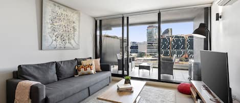 Lounge Area leading to a large balcony overlooking Docklands