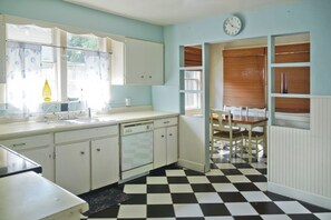 A cozy sunroom with yard view adjoins the kitchen, extra dining area!