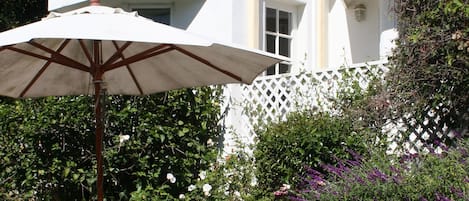 Private cottage with patio table and lounge chair