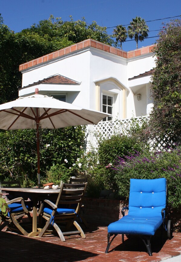 Private cottage with patio table and lounge chair