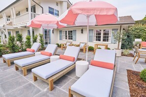 Lounge under iconic coral umbrellas and soak up the Montecito sun