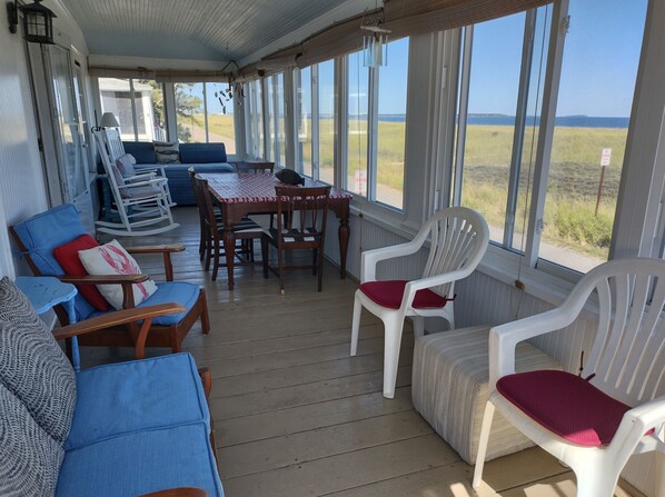 The front porch overlooks the dunes and 7 miles of sandy beach.