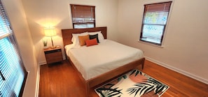 Two master bedrooms with plush King beds and TVs, each with dedicated full baths