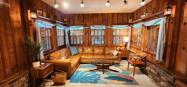 Warm, spacious floor-to-ceiling cedar family room with crisp mid-century touches