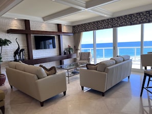 Large Living Room, two comfortable couches, balcony access, gorgeous ocean view