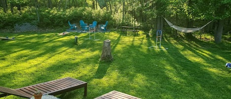 Sit back and relax in the spacious back yard full of activities and lounging options.