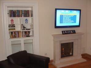 Lounge with real flame gas fire and Sky TV