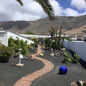 The path up the garden next to the pool