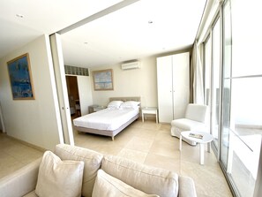 Master bedroom with king size bed, ensuite and aircon. Partition wall open