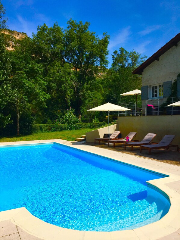 View of pool area and the garden hedge bordering the River Aveyron