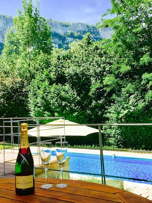 Dining deck with views of the pool, gorge and river