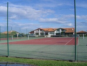 Two tennis courts in complex.