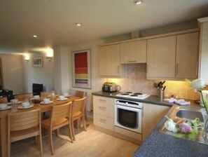 Fitted kitchen with  Dishwasher,   Oven/Hob,  Large Fridge Freezer,    Microwave