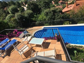 Terrace overlooking pool ( now with a dining table)