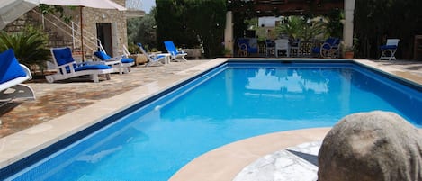 View from back garden to the shaded dining area.