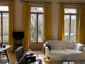 Very large living room with huge marble fireplace