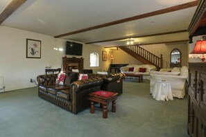 40 foot sitting room with 4, three seater sofas.