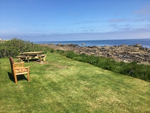 Private front garden with 8 seat picnic table and 3 seat bench