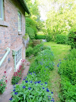 View down the garden to the river at the bottom 