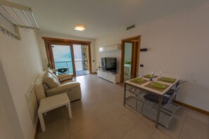 Living room area with view of the lake and large terrace plus lake view