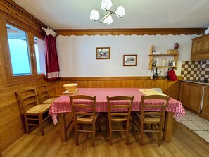 Long dining table with plenty of seating.
