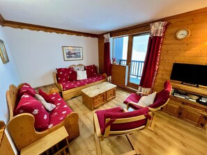 Spacious lounge. Large sofa can function as two single beds.