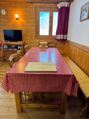 Long dining table with plenty of seating.