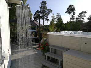 Outdoor shower with heated water