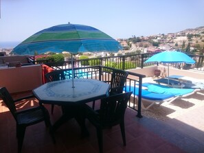 Our patio with private area for sunbeds and a view of the med!