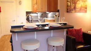 Breakfast bar and comfortable leather stools in Rose's Rest