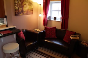 Living area and breakfast bar stools in Rose's Rest.